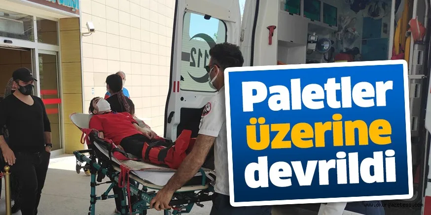 Ayağına paletlerin düştüğü market çalışanı yaralandı