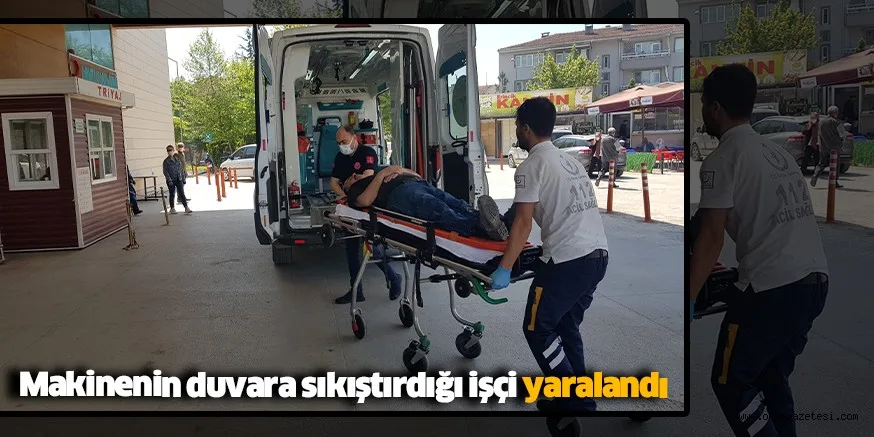 Makinenin duvara sıkıştırdığı işçi yaralandı