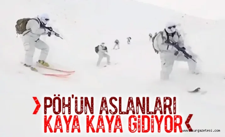 PÖH'ler karla kaplı dağları kayarak geçiyor
