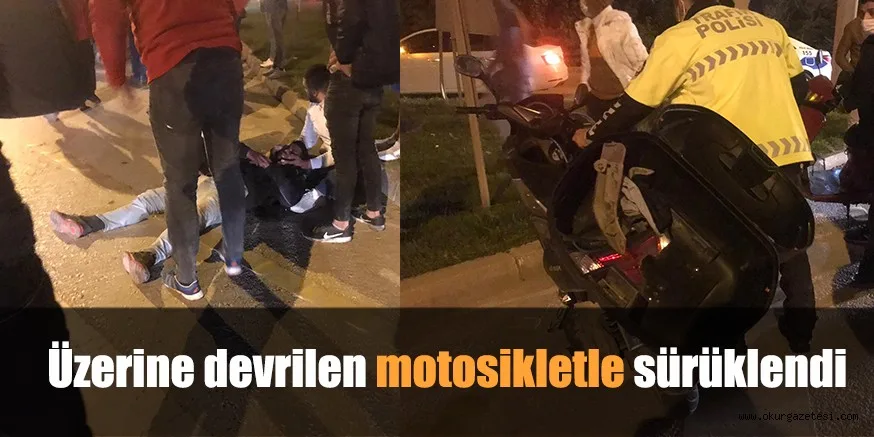 Üzerine devrilen motosikletle sürüklendi