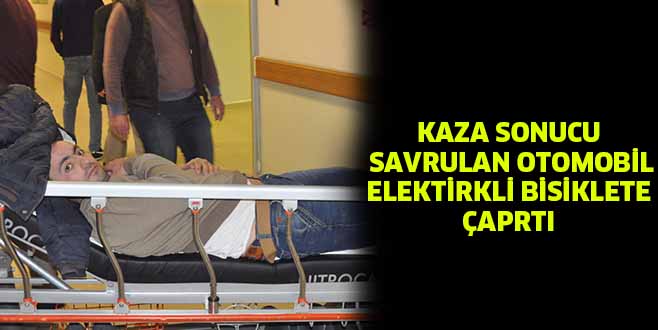 KAZA SONUCU SAVRULAN OTOMOBİL ELEKTİRKLİ BİSİKLETE ÇAPRTI