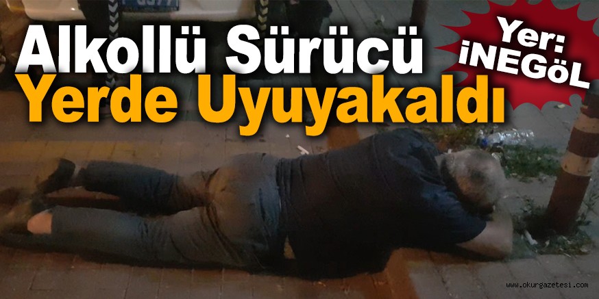 Alkollü sürücü yerde uyuyakaldı