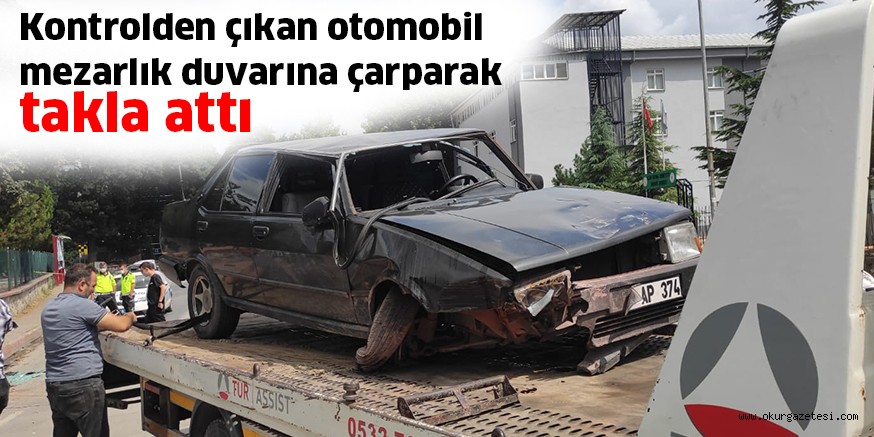 Kontrolden çıkan otomobil mezarlık duvarına çarparak takla attı