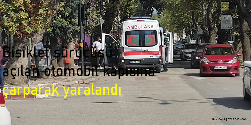 Bisiklet sürücüsü açılan otomobil kapısına çarparak yaralandı